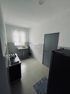 a small bathroom with a shower and a sink at Aristar D'Sejahtera Homestay 4 mu5lim in Bandar  Pusat Jengka