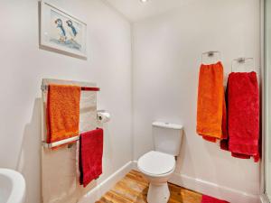 a bathroom with a toilet and colorful towels at 1 Bed in Dunning CA333 in Dunning +31 photos