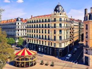 a gazebo in the middle of a city with buildings at Carlton Hotel Lyon - MGallery Collection in Lyon