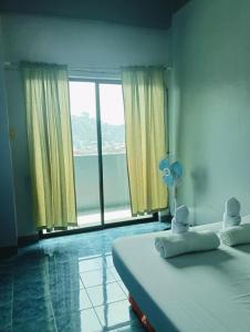 Ένα ή περισσότερα κρεβάτια σε δωμάτιο στο Your Room Near Burnham Park