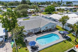 an aerial view of a house with a swimming pool at 368 Carmine Dr in Cocoa Beach