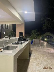 a kitchen with a sink and a counter top at Jeda Village in Higuey