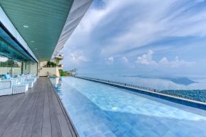 a swimming pool with a view of the ocean at The Lake Hotel Tagaytay in Tagaytay
