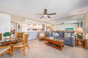 a living room with a couch and a table at Papakea B201 · PK B201 Updated Condo w Ocean View in Kahana