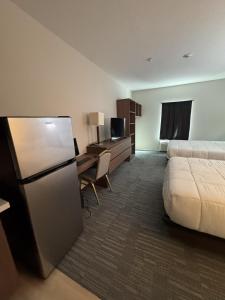 TV a/nebo společenská místnost v ubytování Hotel de Luxe Extended Stay