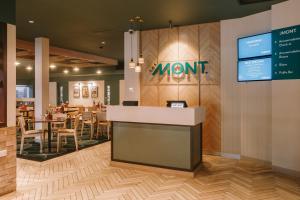 a restaurant with a momnt sign on a wall at Claremont Hotel in Claremont