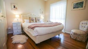 Ένα ή περισσότερα κρεβάτια σε δωμάτιο στο Harrietville Cottage