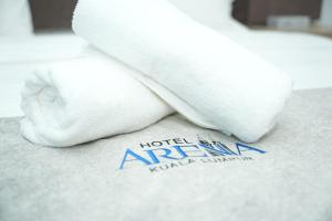 a stuffed animal is sitting on top of a towel at Arena Suites Kuala Lumpur in Kuala Lumpur