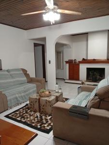 a living room with a couch and a table at Apartamento moderno y luminoso ,con 2 dormitorios in Rivera