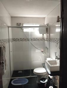 a small bathroom with a toilet and a sink at Apartamento moderno y luminoso ,con 2 dormitorios in Rivera