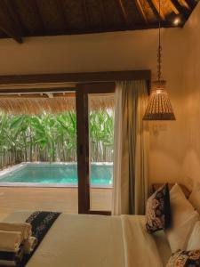 Πισίνα στο ή κοντά στο RATU Village - Luxury Apartement & Beachfront Villa Gili Air