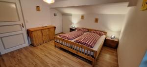 En eller flere senge i et værelse på Sonniges Appartement und Gästezimmer, Haus Borowiec