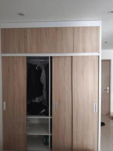 a sliding glass door of a wardrobe in a room at Linh Kinh Bắc in Hòa Bình