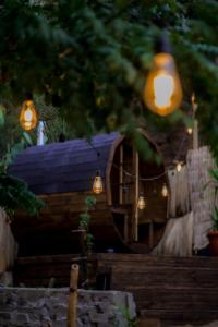 a group of lights hanging from a house at rincon sukhino in Lo Narváez