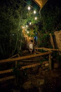 a horse standing on a wooden bridge at night at rincon sukhino in Lo Narváez