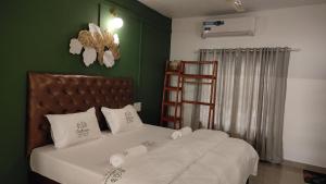 Ένα ή περισσότερα κρεβάτια σε δωμάτιο στο Trattorias Tranquil