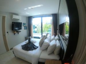 Giường trong phòng chung tại Silk Ao Nang Condominium +273 ảnh