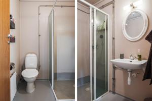 a bathroom with a shower and a toilet and a sink at Skogsbrynet B&B, Bredsjö Nya Herrgård in Hällefors +78 photos