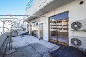 an empty balcony of a building with windows at Setolive別邸 by 4S STAY in Takamatsu