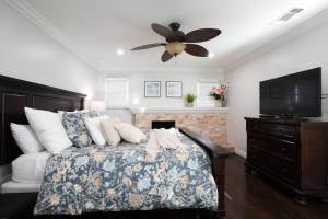 a bedroom with a bed and a ceiling fan at Destination #22 in Anaheim