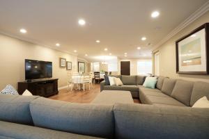 a living room with a couch and a flat screen tv at Destination #31 in Anaheim