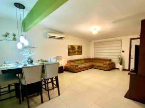 a living room with a couch and a table at Casa Futuro in San Lorenzo