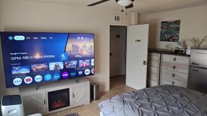 a living room with a large flat screen tv at Golden House in Santa Clarita