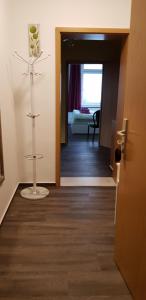 a room with a door open to a living room with a room at Villa Amilia - Ferienwohnung 2 in Waren