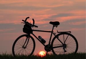 a bike parked in front of the sunset at Heritage Grand in Galgamuwa