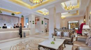 a lobby of a hotel with a couch and a counter at Vienna Hotel Kunming Beijing Road Chuanxin Gulou Metro Station in Kunming
