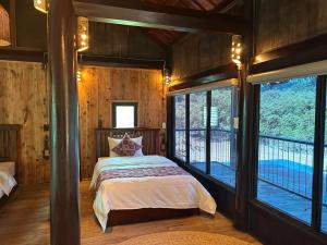 Postel nebo postele na pokoji v ubytování HaGiang Go Ecolodge