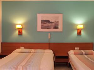 Postel nebo postele na pokoji v ubytování Hotel El Castell