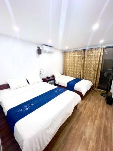 Ένα ή περισσότερα κρεβάτια σε δωμάτιο στο NOOK INN in the heart of Old Quarter