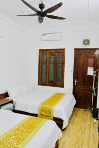 Ένα ή περισσότερα κρεβάτια σε δωμάτιο στο NOOK INN in the heart of Old Quarter +11 φωτογραφίες