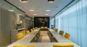a conference room with a long table and yellow chairs at Jinjiang Inn Tianjin Zhongshan Road in Tianjin