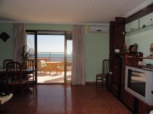a living room with a view of the ocean at Apartamentos Raymar in Oropesa del Mar