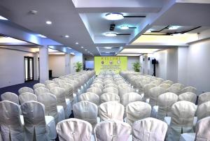 a room with rows of white chairs in it at Subic Bay Venezia in Olongapo +182 photos