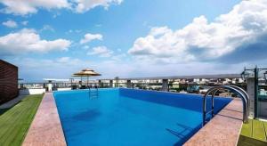 a large swimming pool on the roof of a building at Galaxy Hotel in Jeju