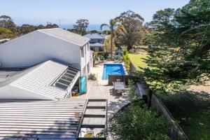 an aerial view of a house with a swimming pool at Villa Solare - Pet friendly Retreat with Pool and Spa in Mount Martha