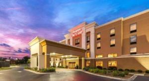 a rendering of a hotel at dusk at Hampton Inn & Suites Savannah-Airport in Savannah