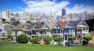 a row of houses with a city in the background at The Annex - Hayes Valley in San Francisco