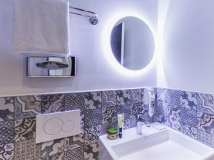 a bathroom with a sink and a mirror at ibis Styles Paris Gare de l'Est TGV in Paris