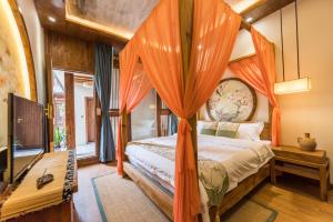 Postel nebo postele na pokoji v ubytování Lijiang Yue Tu Inn