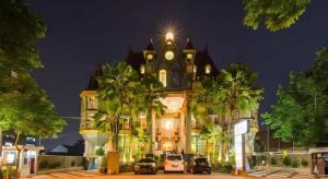 a building with a clock tower on top of it at Gajahmada Graha Hotel in Malang
