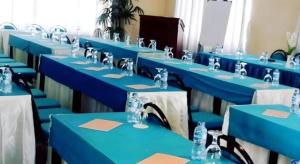 a row of blue tables in a room at Bumi Ciherang Hotel in Puncak +38 photos