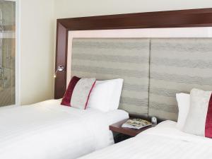 Giường trong phòng chung tại Novotel Atlantis Shanghai - Enjoy our great-valued breakfast in our rooftop revolving restaurant with a stunning river view & utilize our FREE self-serviced laundry +124 ảnh