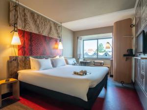 Giường trong phòng chung tại ibis Amsterdam Centre Stopera +70 ảnh