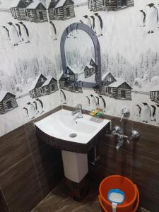 a bathroom with a sink and a toilet at Mannata Homesaty in Darjeeling
