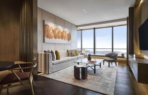 a living room with a couch and a table at Park Hyatt Kuala Lumpur in Kuala Lumpur