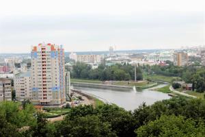 a view of a river in a city with buildings at Apartments Crystal in Oryol